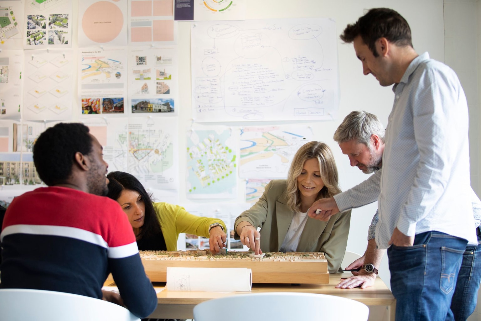 BDP designers reviewing a architectural model