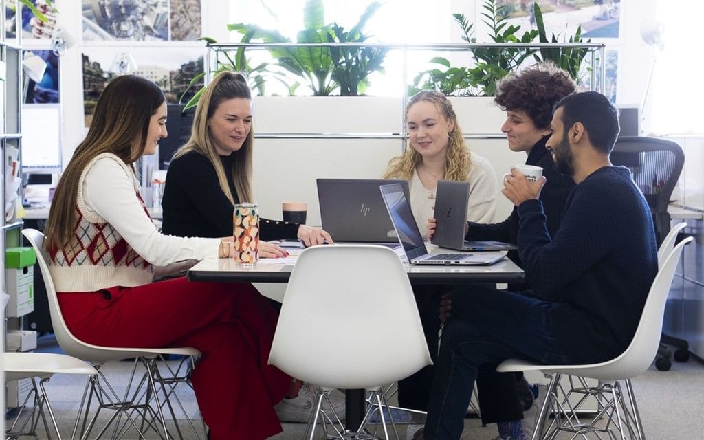 Sustainability team gathered around a table