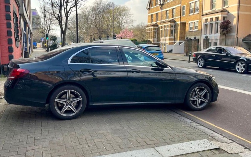 A car blocking a pavement